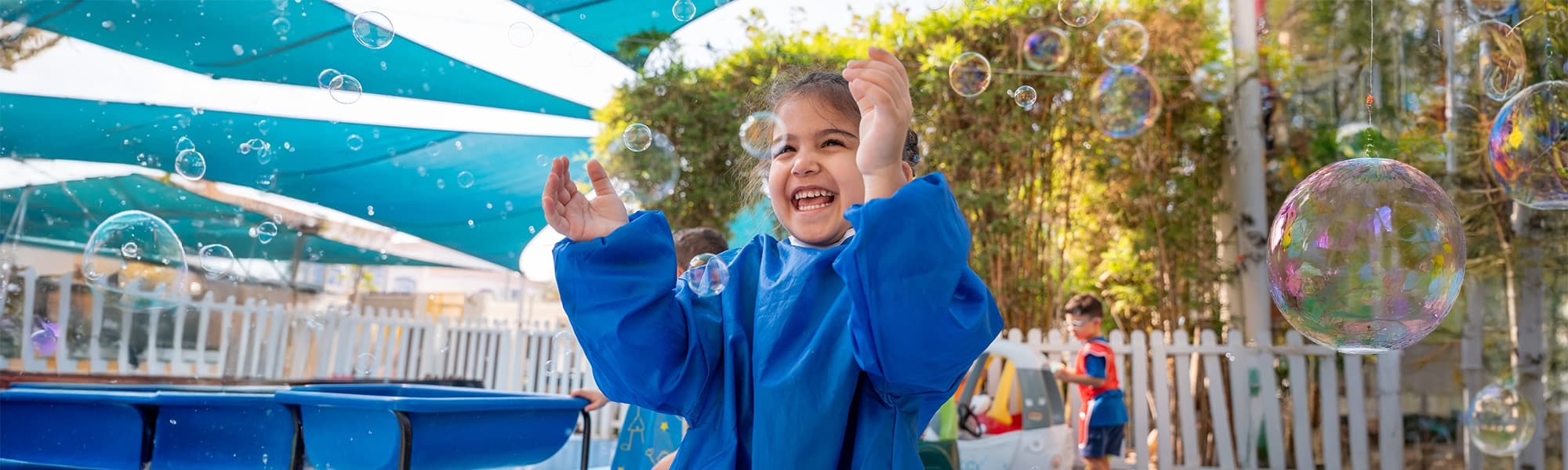 Children playing outside at Bright Beginnings Nursery Abu Dhabi